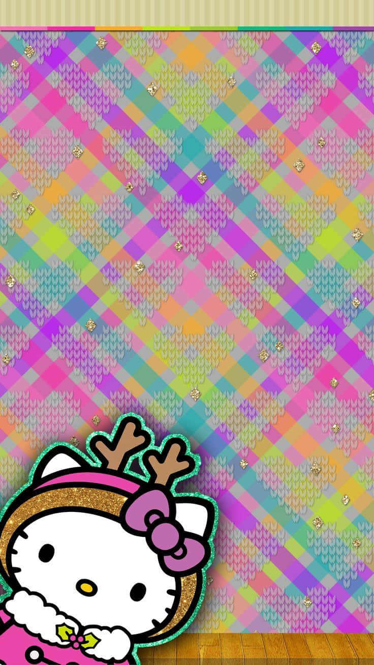 Hello Kitty Christmas 桌布 壁紙 — Hello Kitty 戴著馴鹿角與蝴蝶結，站在木地板上，背景是閃閃發光的彩虹針織圖案。