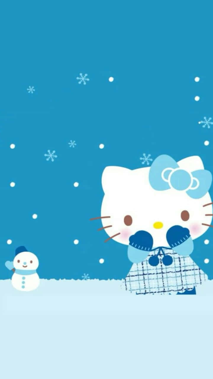 Hello Kitty Christmas 桌布 壁紙 — Hello Kitty 穿著冬季外套站在雪人旁邊，背景是藍天和飄落的雪花。
