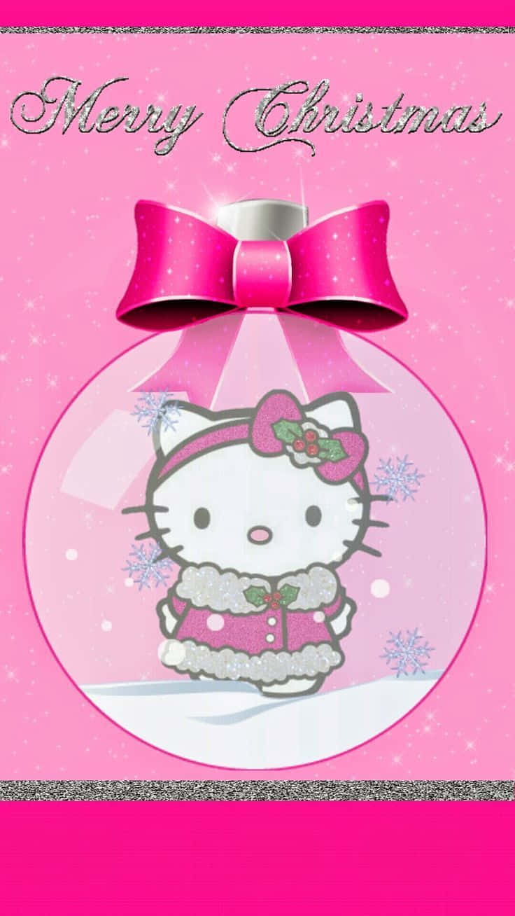 Hello Kitty 桌布 壁紙 — Hello Kitty 穿著粉紅色冬季外套，在一個帶有閃亮蝴蝶結和雪花的水晶球內，背景為粉紅色。