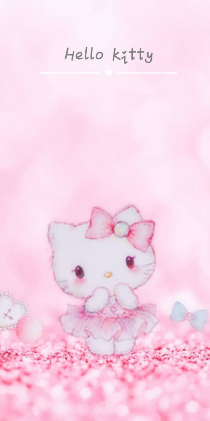 Pink Hello Kitty 桌布 壁紙 — Hello Kitty 身穿粉紅色芭蕾舞裙，站在閃閃發光的粉紅色地面上，背景是柔和的粉紅色散景。
