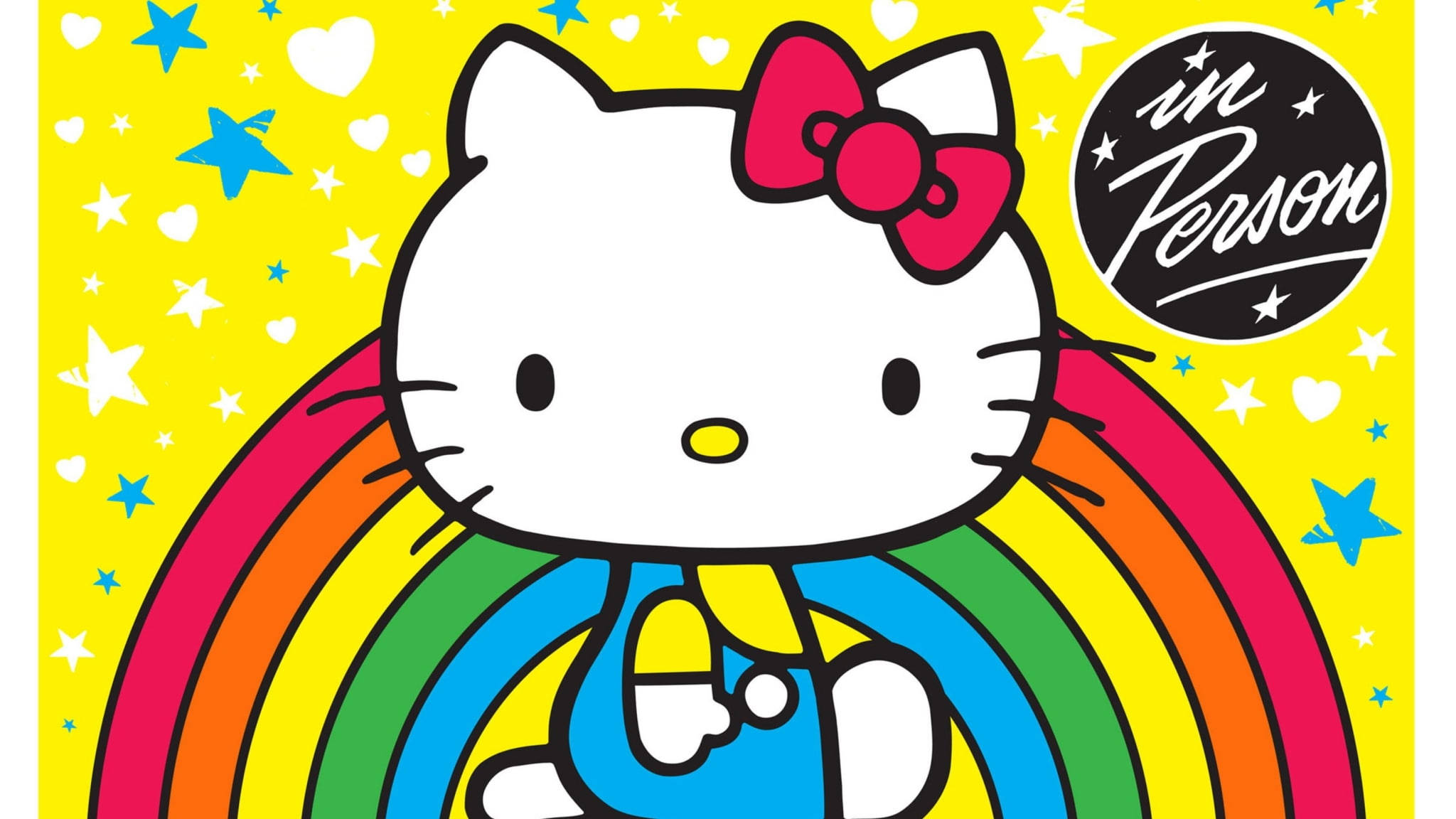 Hello 桌布 壁紙 — Hello Kitty 身穿藍色吊帶褲，站在色彩繽紛的彩虹後面，背景是黃色，點綴著星星和愛心。