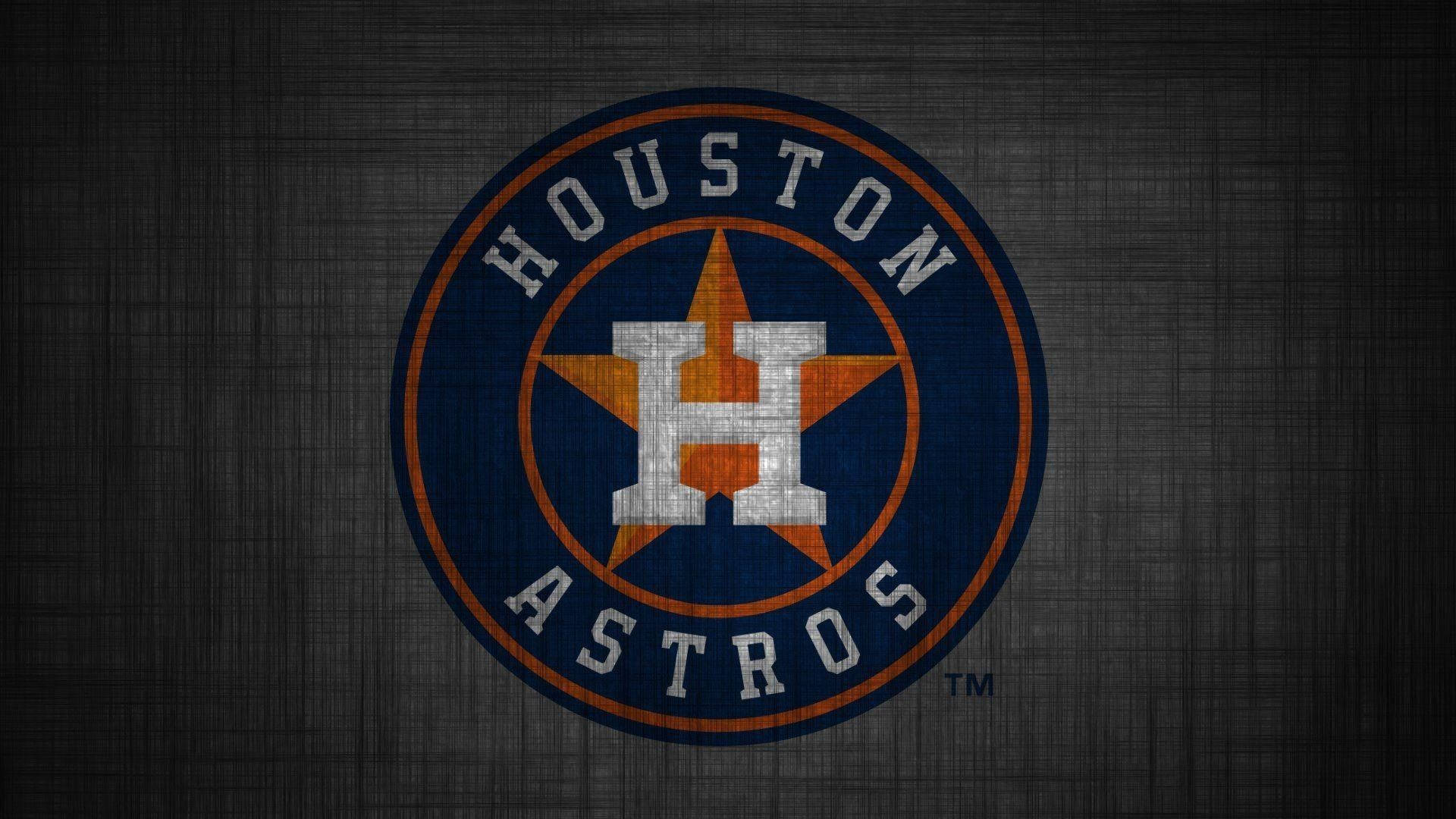 Astros 桌布 壁紙 — Houston Astros 標誌，帶有磨損質感，背景為深灰色布料。
