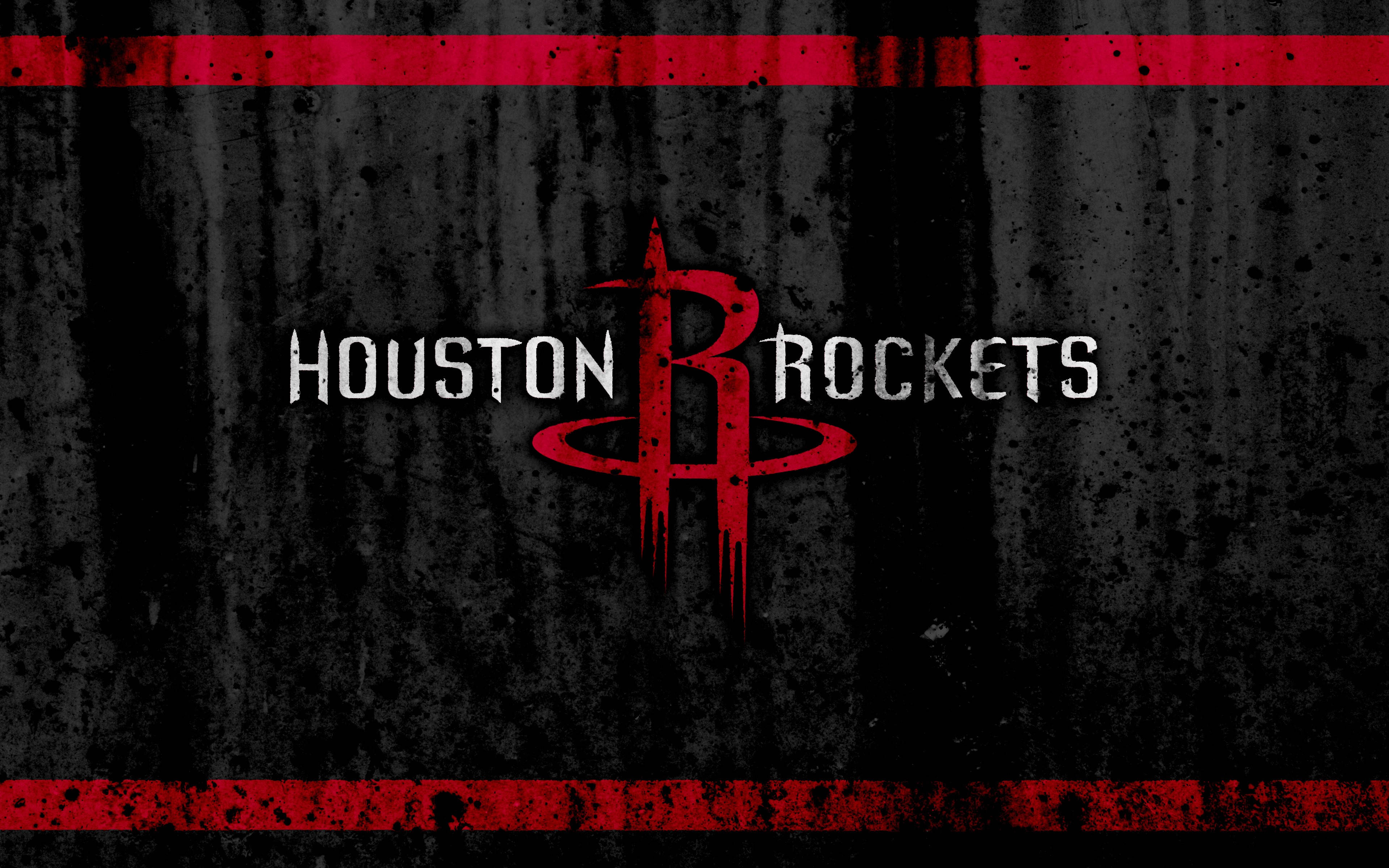 Houston Rockets 桌布 壁紙 — Houston Rockets 標誌以粗體紅白色呈現，背景為粗糙黑色紋理並帶有紅色條紋。