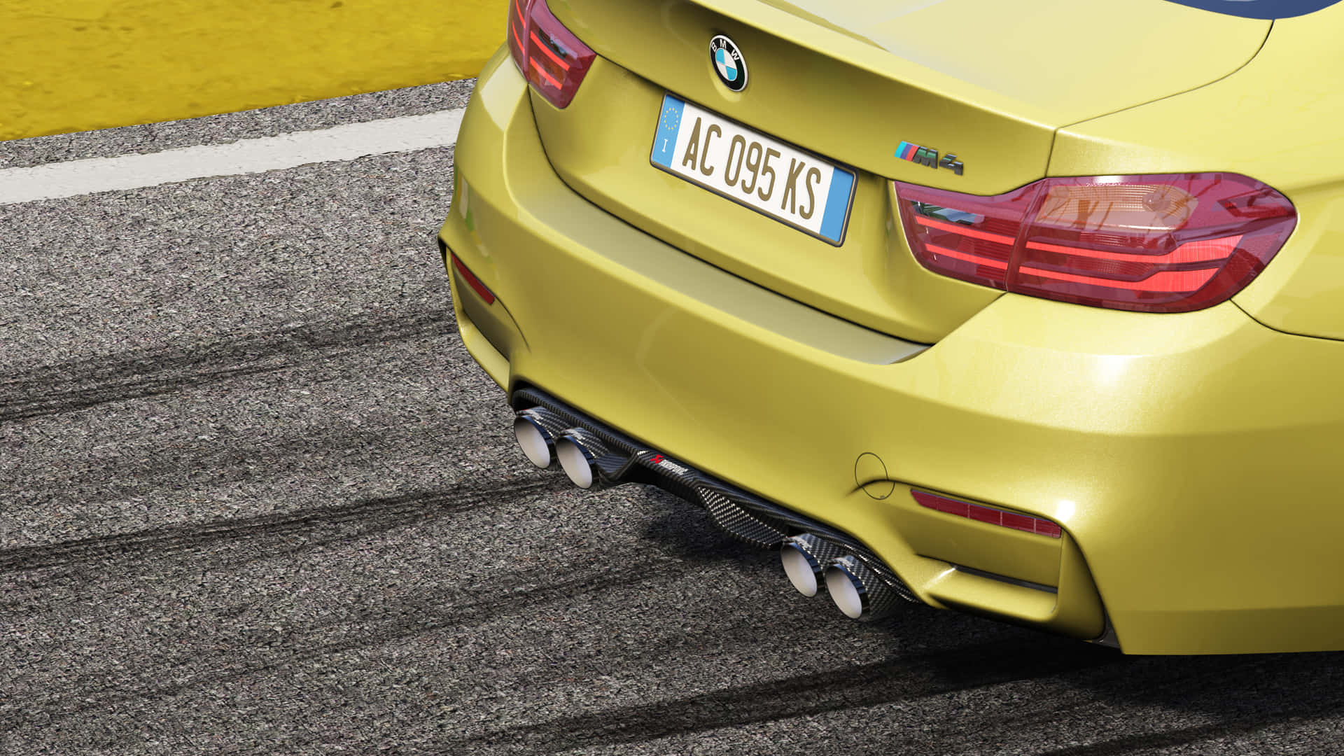 黃色BMW M4賽車後部，排氣管在賽道瀝青上 — 4K BMW 壁紙 壁紙