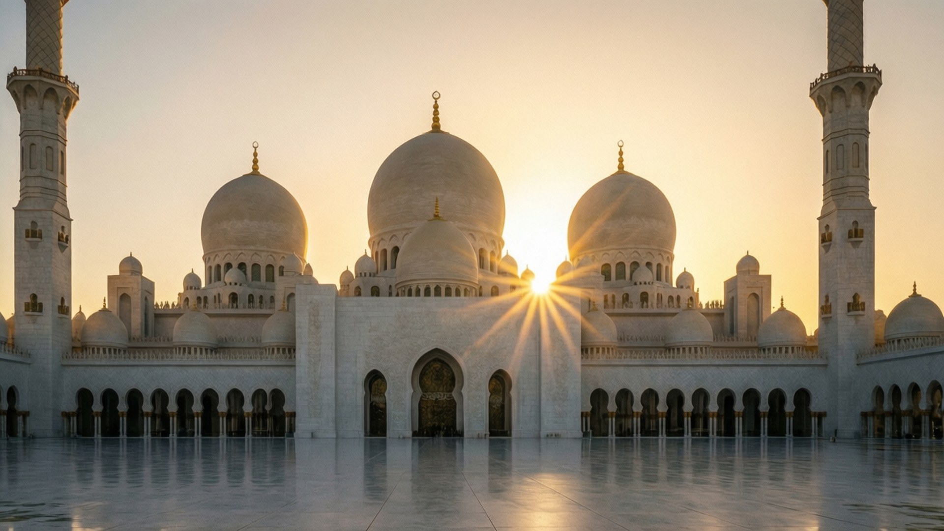 Grand Mosque Golden Sunset 壁紙 — 在黃金時刻，陽光照射著清真寺宏偉的白色圓頂和宣禮塔，在反光的大理石地板上投射出燦爛的光芒。