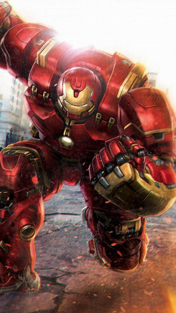 Avengers Phone 桌布 壁紙 — Hulkbuster 裝甲以動態姿勢站立，帶有發光的紅色和金色細節，背景是模糊的城市景觀。