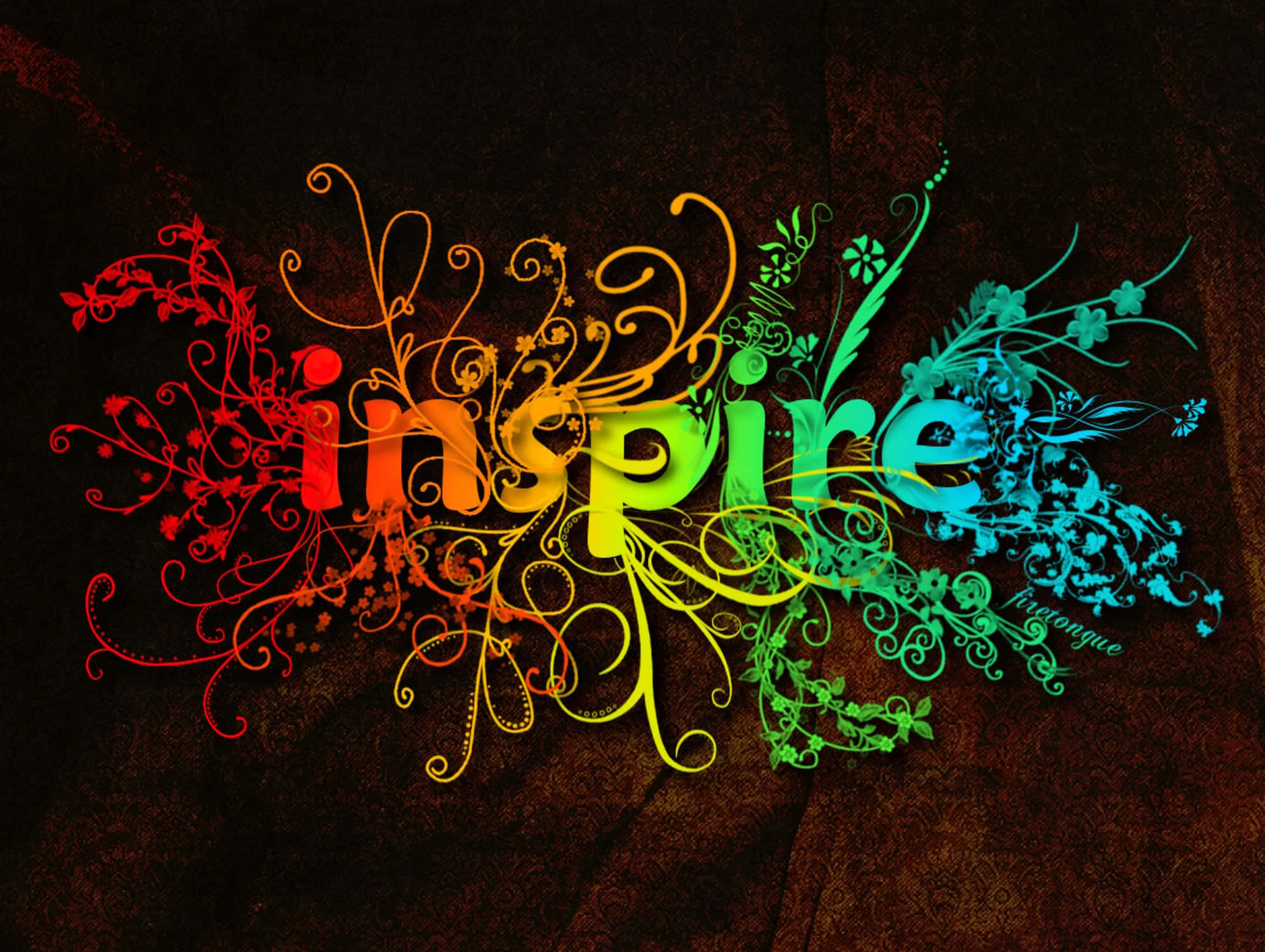 Funky 桌布 壁紙 — 「inspire」一詞在深色紋理背景上，被華麗的花卉漩渦環繞，散發出彩虹色光芒。