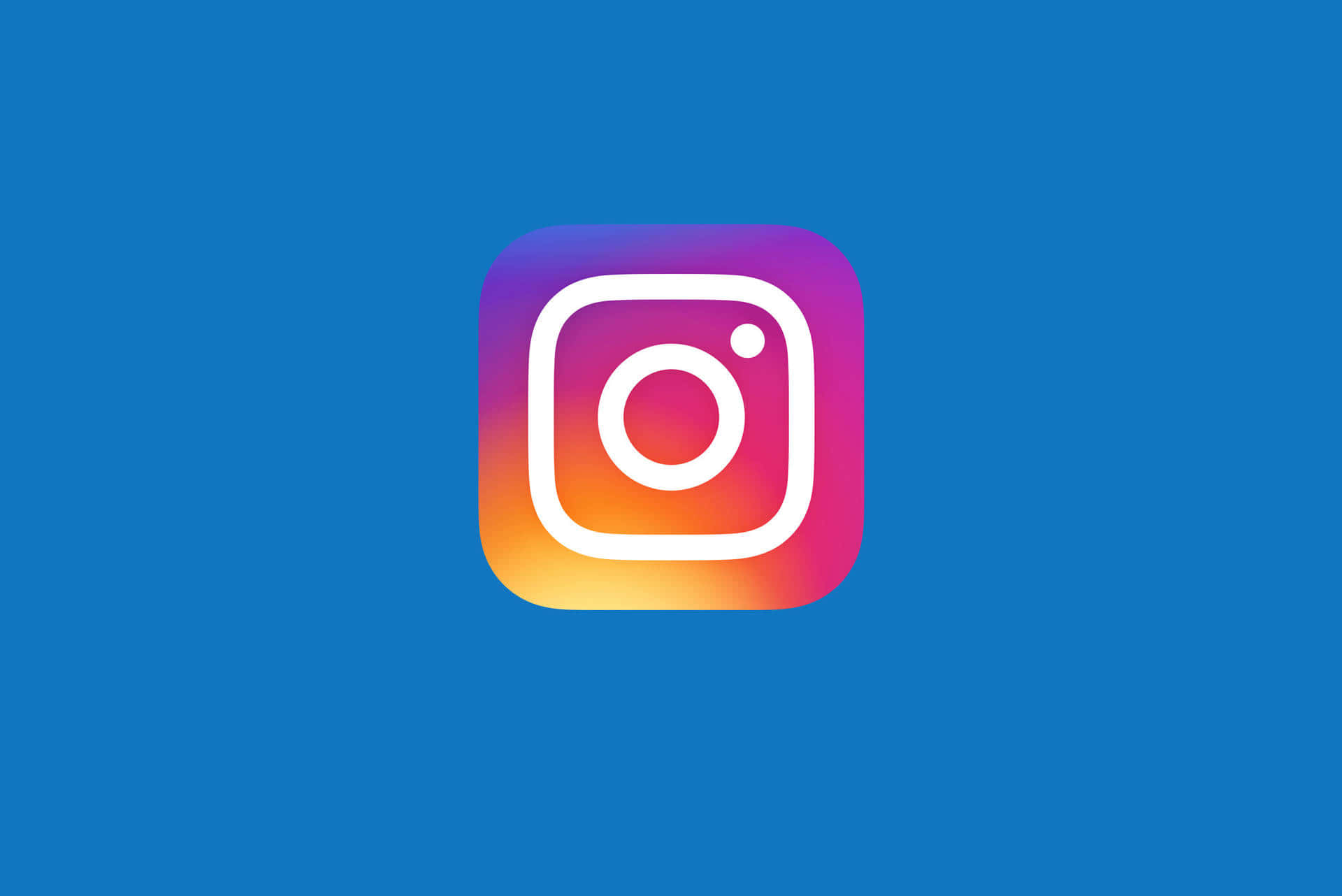 Logo Design 桌布 壁紙 — Instagram 標誌居中於純藍色背景上，帶有鮮豔的漸變邊框。