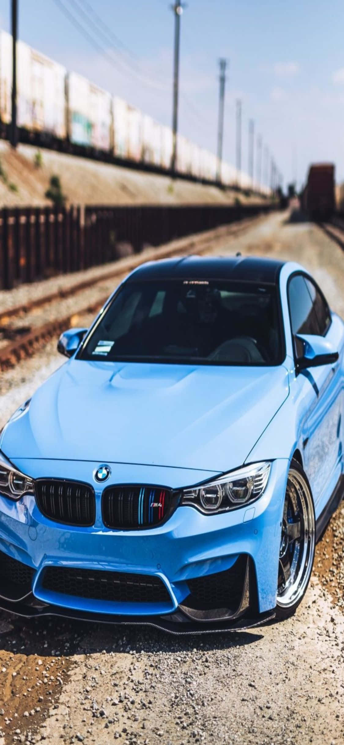 高科技與奢華。iPhone X 與時尚 BMW 並列。 壁紙