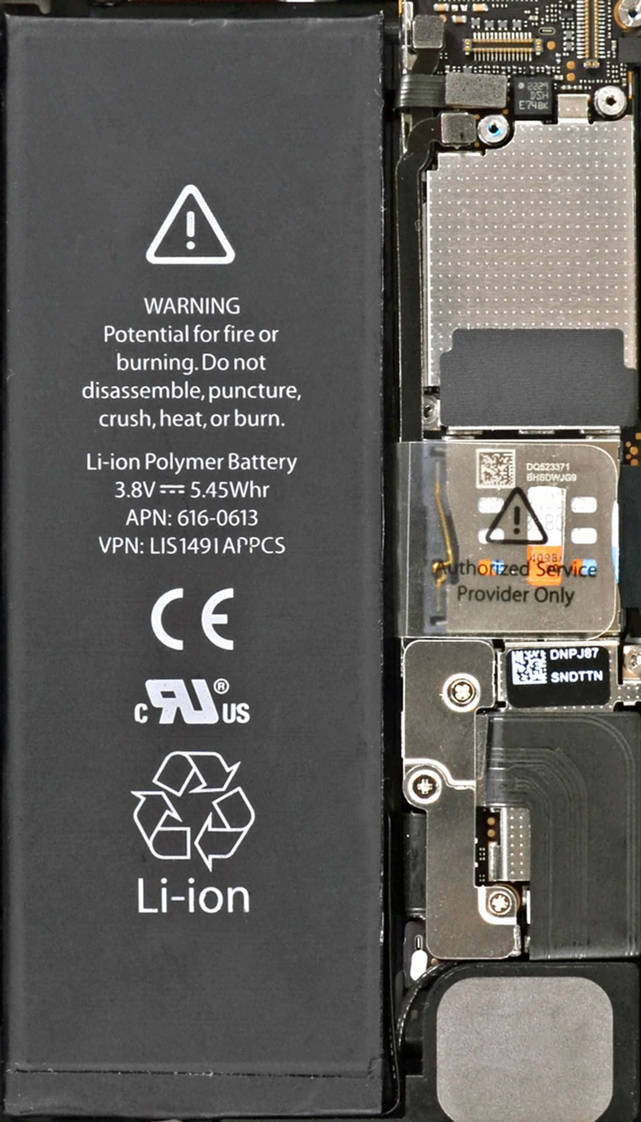 Inside iPhone 桌布 壁紙 — iPhone 內部組件的特寫，顯示電池警告標籤和電路板細節。