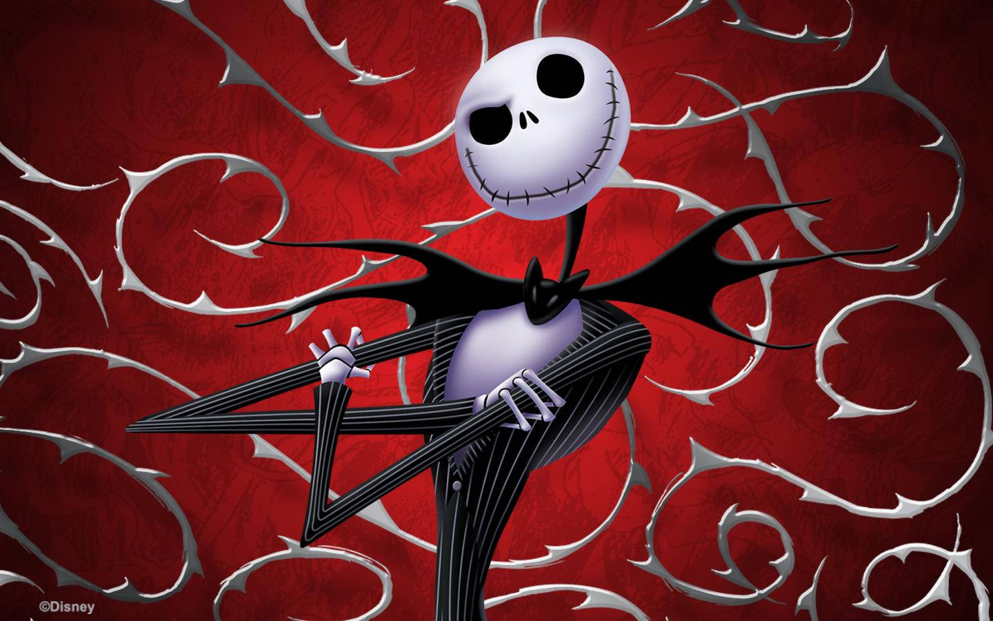 nightmare 桌布 壁紙 — Jack Skellington 穿著他標誌性的黑色西裝，站在旋轉的紅色和銀色華麗背景前。
