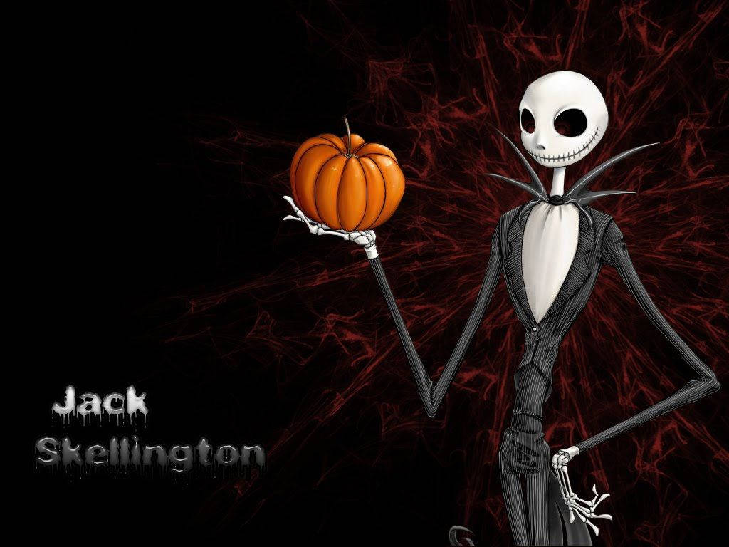 傑克·史克林頓 桌布 壁紙 — Jack Skellington 拿著一個橙色南瓜，背景是深紅色蜘蛛網，露出他標誌性的笑容。