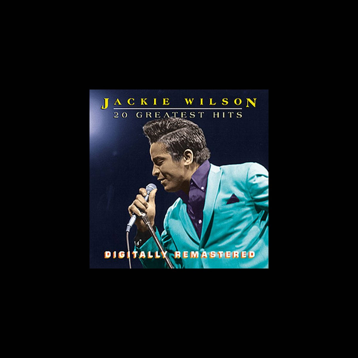 Singer 桌布 壁紙 — Jackie Wilson 身穿青綠色西裝，在黑暗背景的舞台燈光下對著麥克風唱歌。