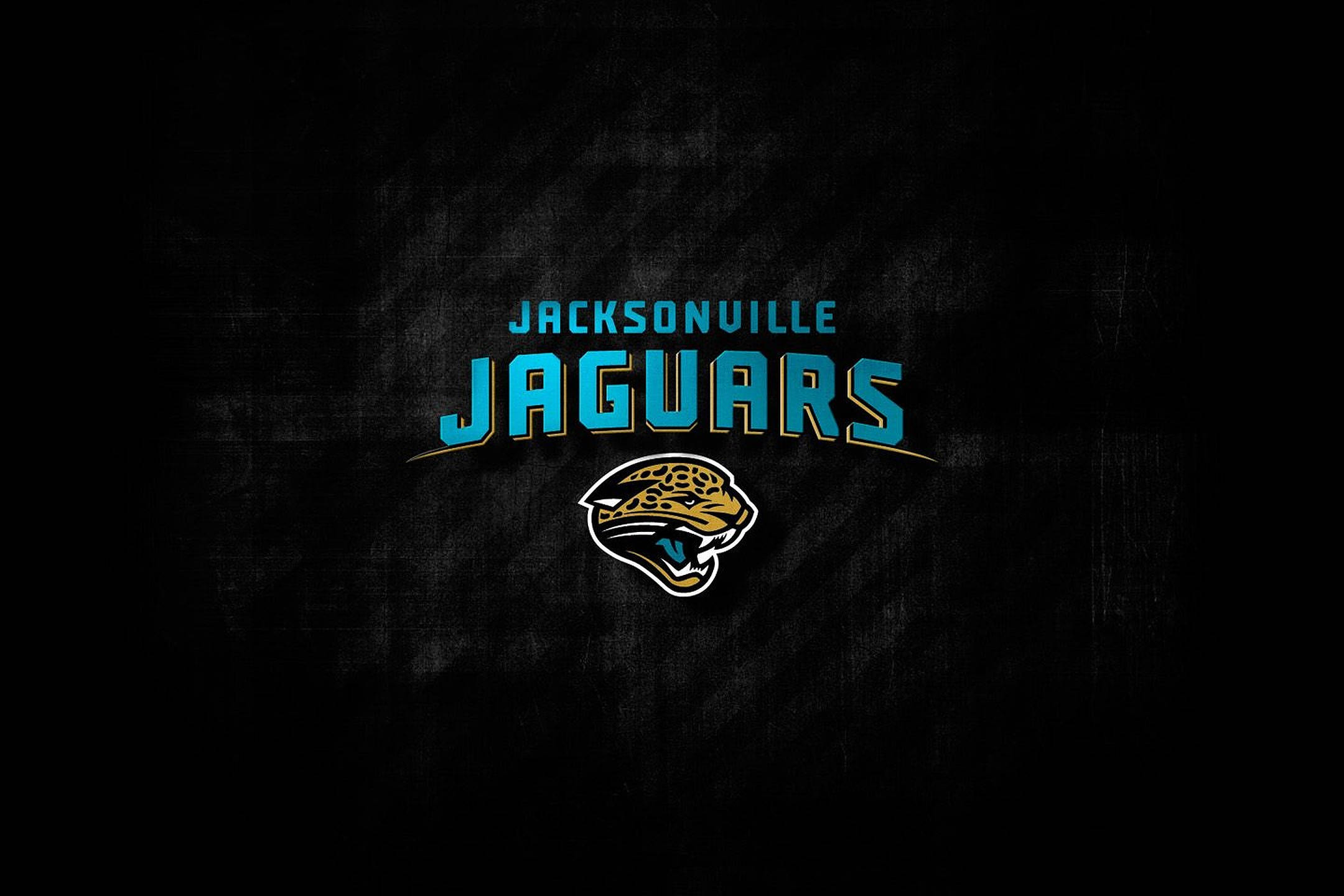 Jaguars 桌布 壁紙 — Jacksonville Jaguars 標誌以青綠色和金色在紋理黑色背景上發光。