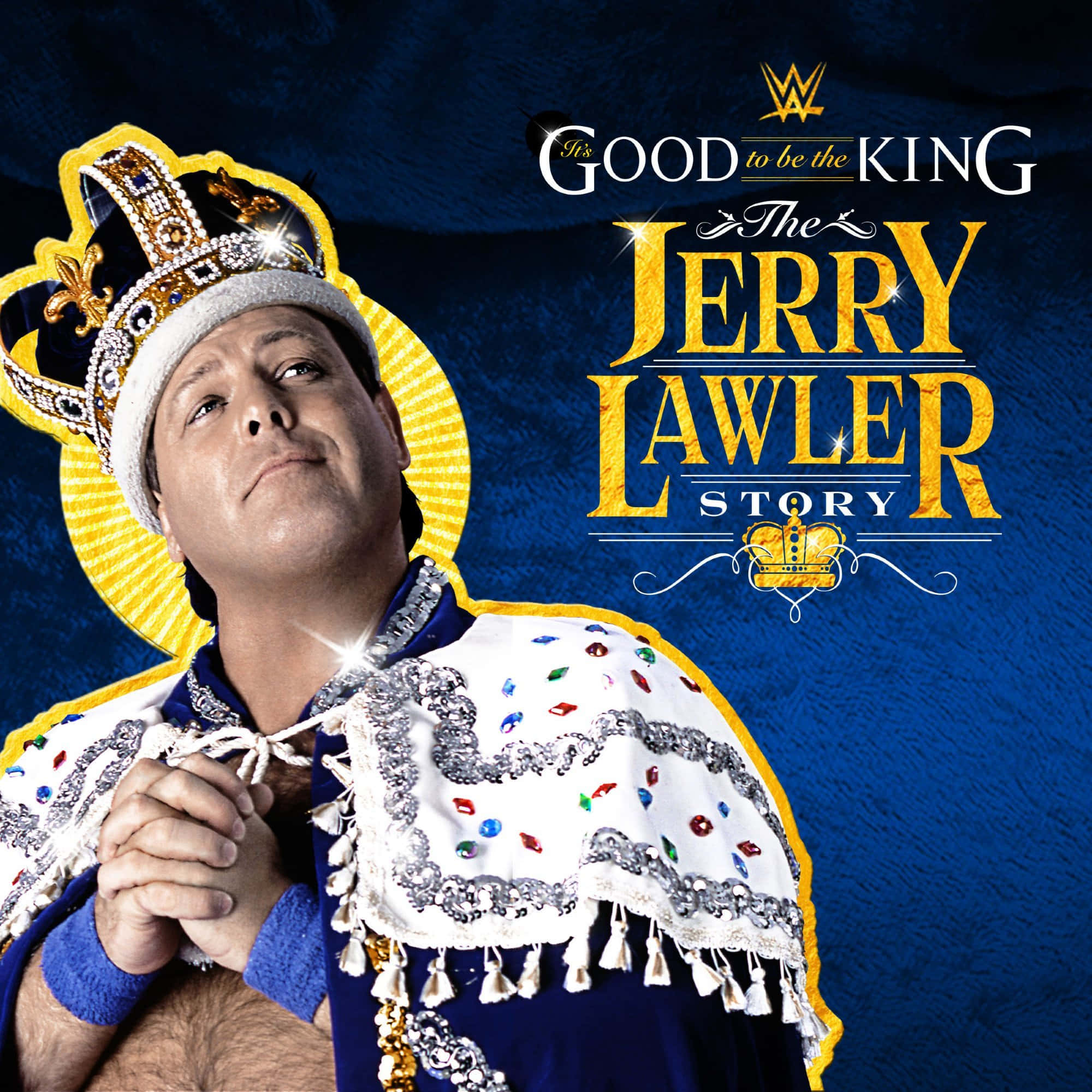 摔角 桌布 壁紙 — Jerry Lawler 身穿皇家服飾，頭戴王冠，披著鑲有寶石的斗篷，背景為深藍色紋理。