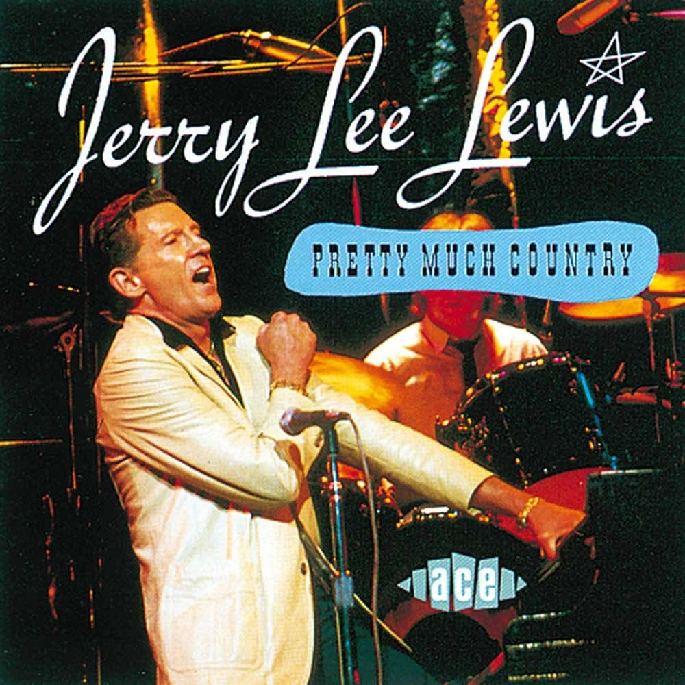 Jerry Lee Lewis 桌布 壁紙 — Jerry Lee Lewis 穿著白色西裝對著麥克風唱歌，在舞台上進行充滿活力的鋼琴表演。