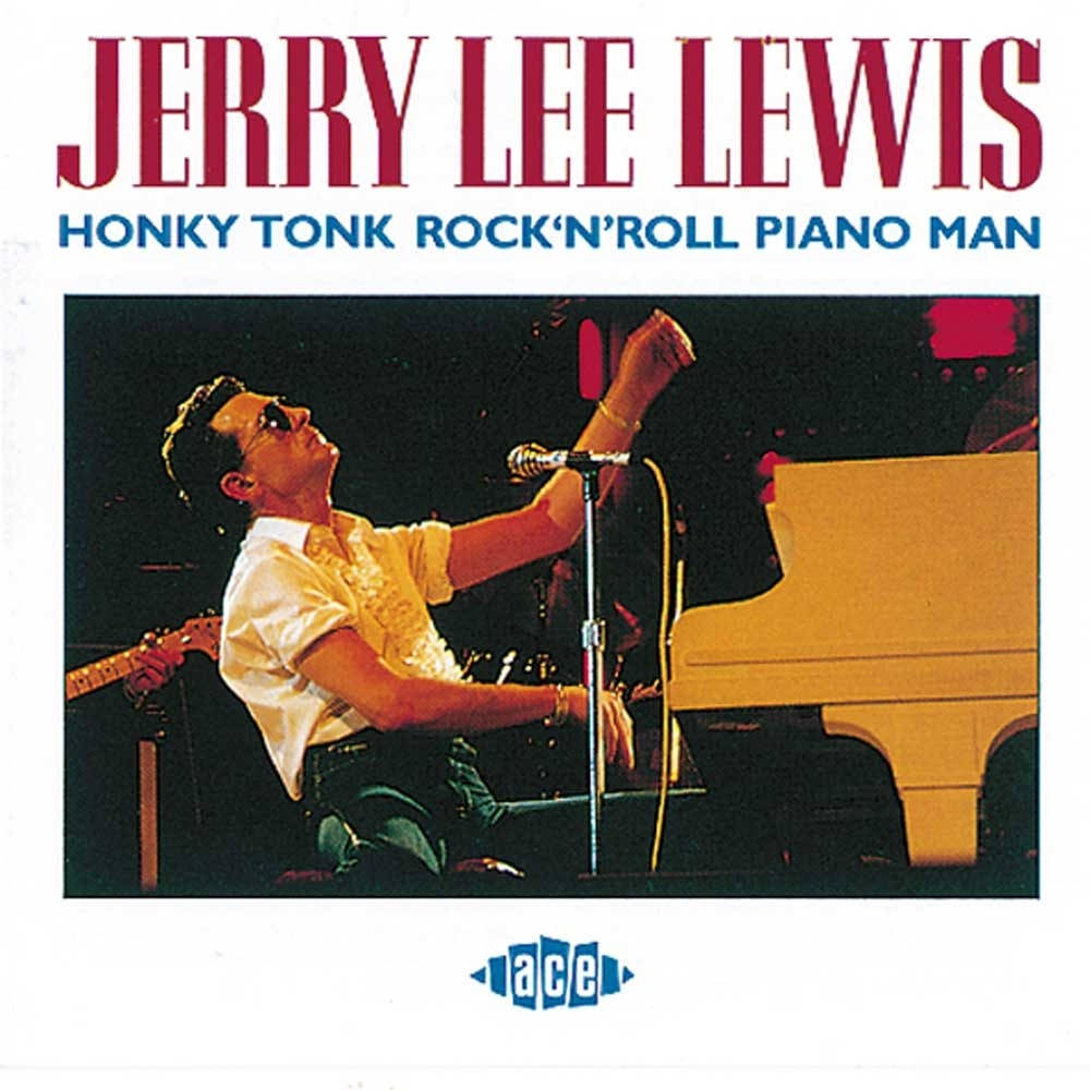 Jerry Lee Lewis 桌布 壁紙 — Jerry Lee Lewis 在戲劇性的舞台燈光下熱情地彈奏鋼琴，面前有一個麥克風。