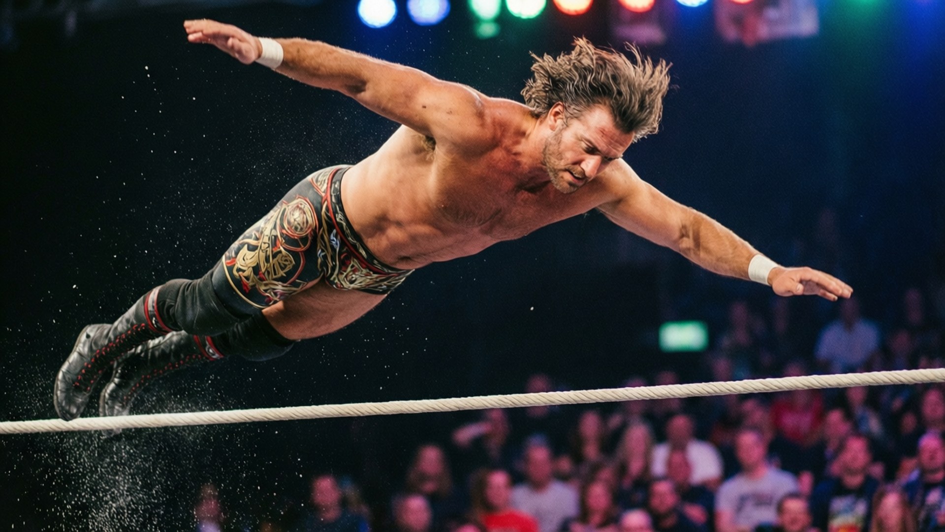 Nick Aldis High Flyer 壁紙 — 一位肌肉發達的摔角手在半空中越過繩索表演高飛動作，下方是燈光明亮的競技場和歡呼的人群。