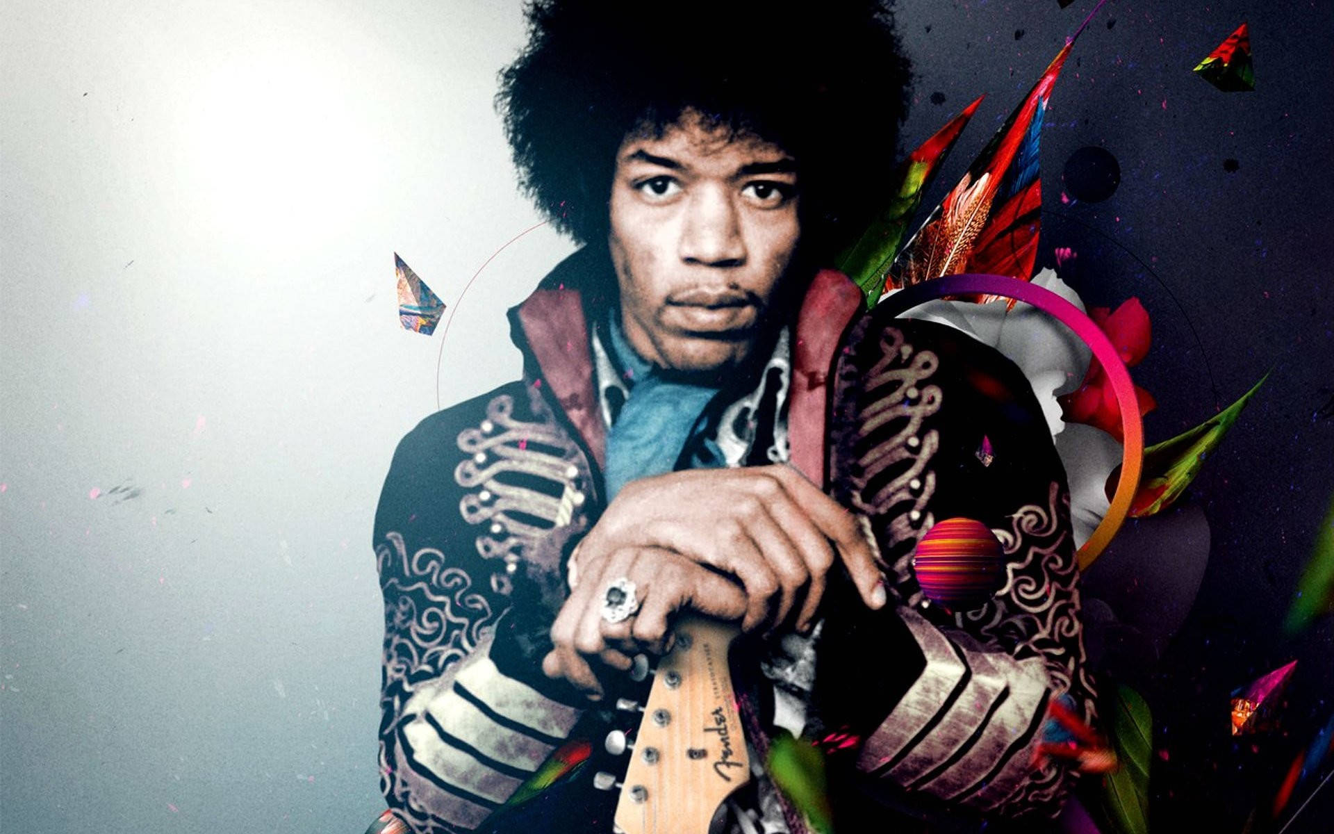 Celebrity 桌布 壁紙 — Jimi Hendrix 專注地凝視，手持 Fender 吉他，置身於充滿活力的抽象潑濺和色彩繽紛的幾何碎片之中。