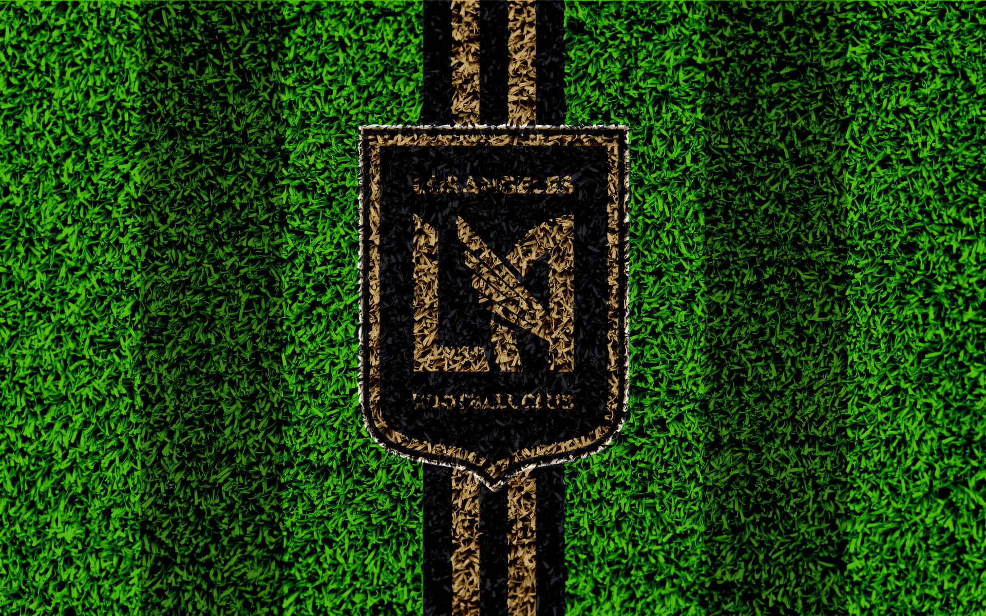 LAFC足球隊標誌在綠色草地上帶有黑色條紋 — 4K 壁紙
