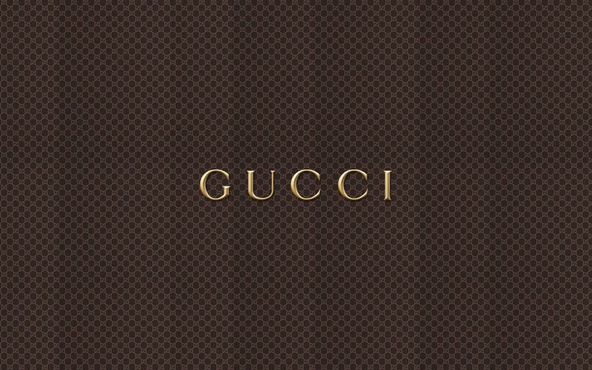 金色Gucci標誌在棕色字母圖案背景上 — Valorant Logo 壁紙