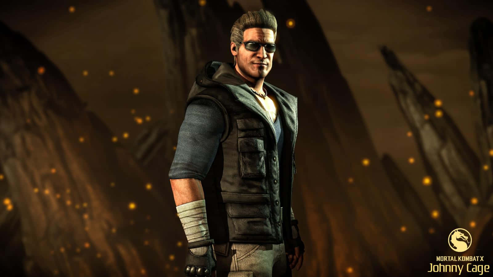 Johnny Cage 桌布 壁紙 — Johnny Cage 來自《真人快打X》自信地站在一個岩石競技場中，發光粒子在他周圍旋轉。
