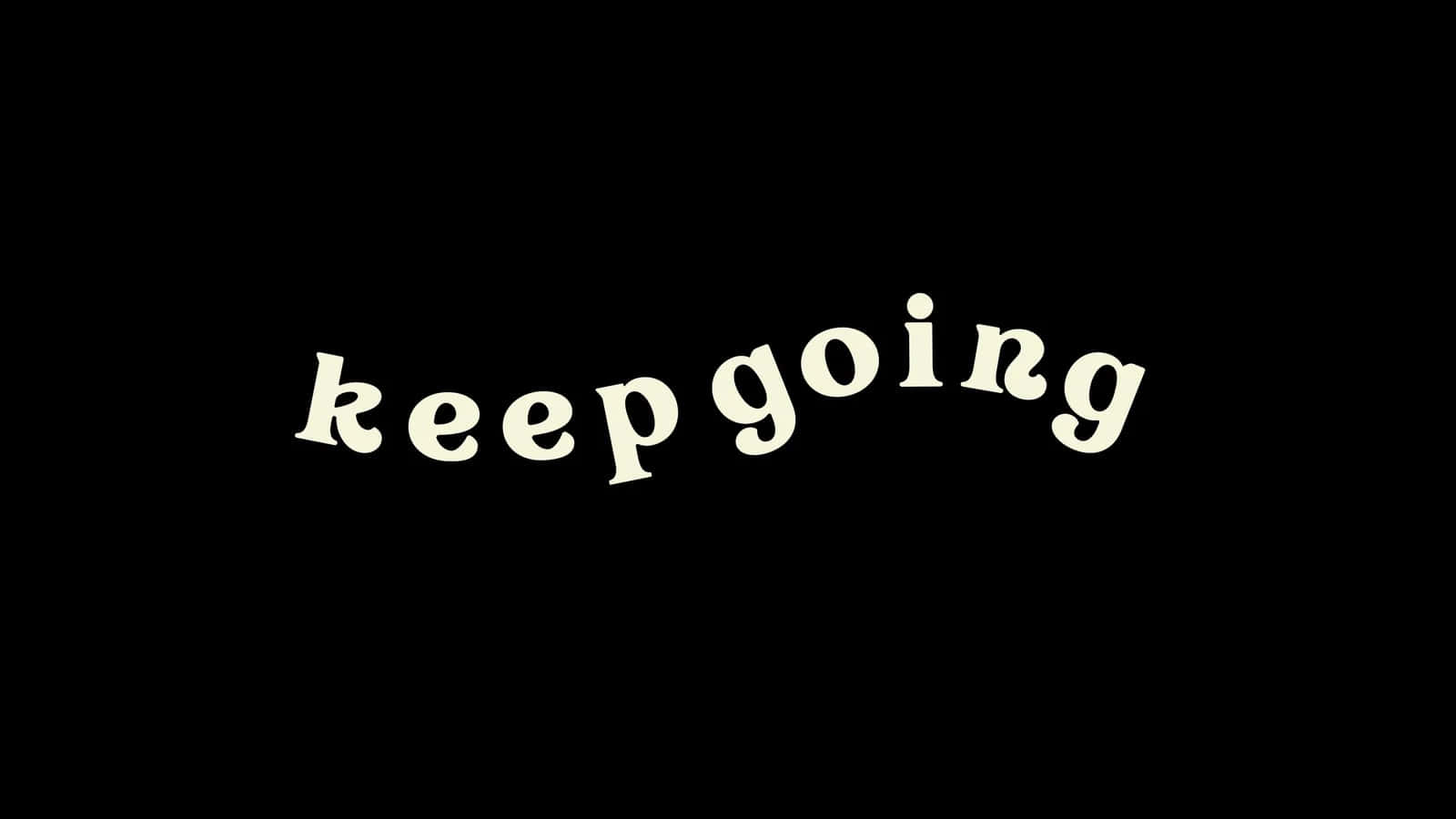 Aesthetic Black And White 桌布 壁紙 — 「keep going」這個短語以奶油色字體在純黑色背景上發光。