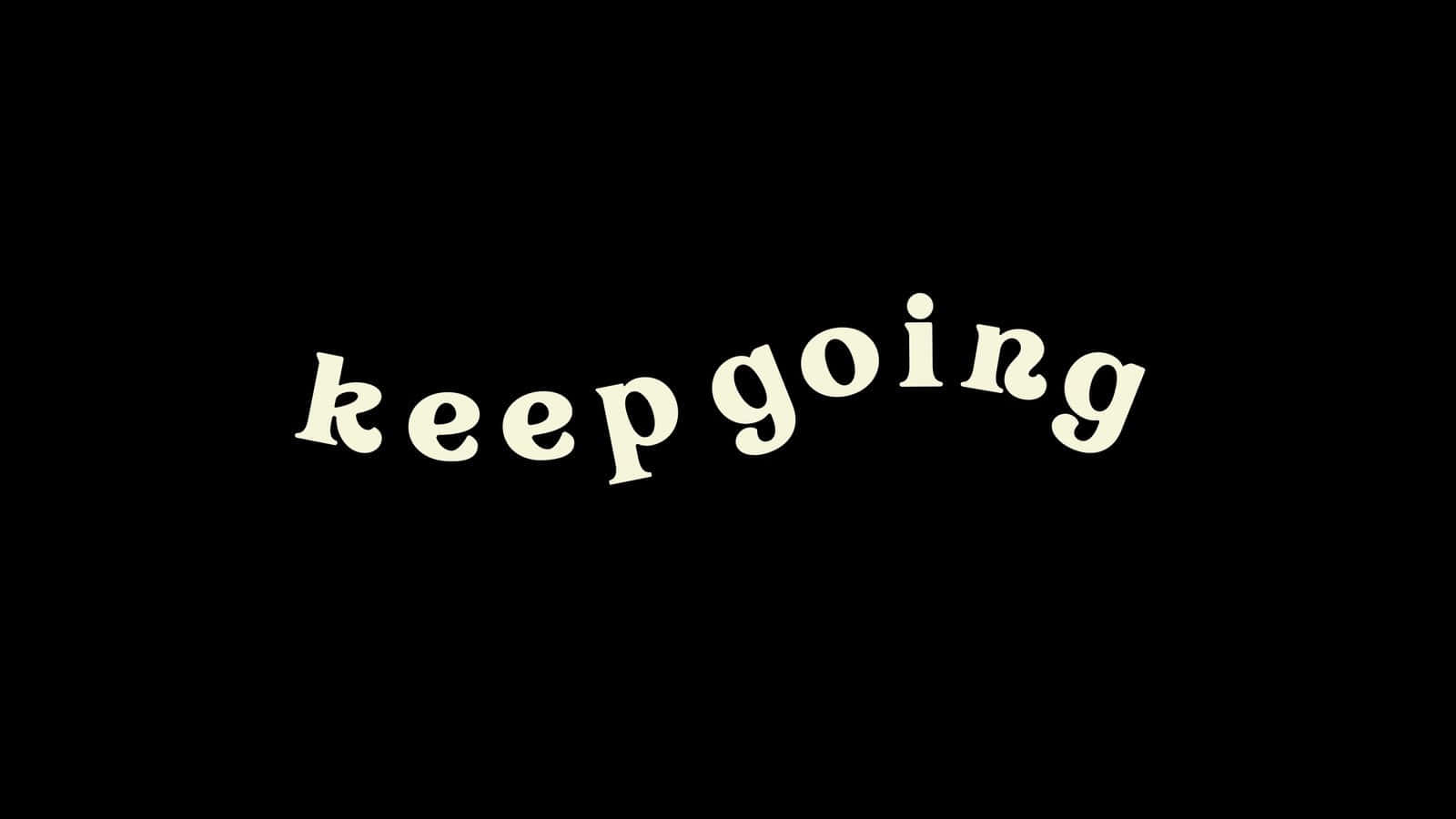 Keep Going 桌布 壁紙 — 「keep going」這個短語以奶油色手寫字體在純黑色背景上發光。