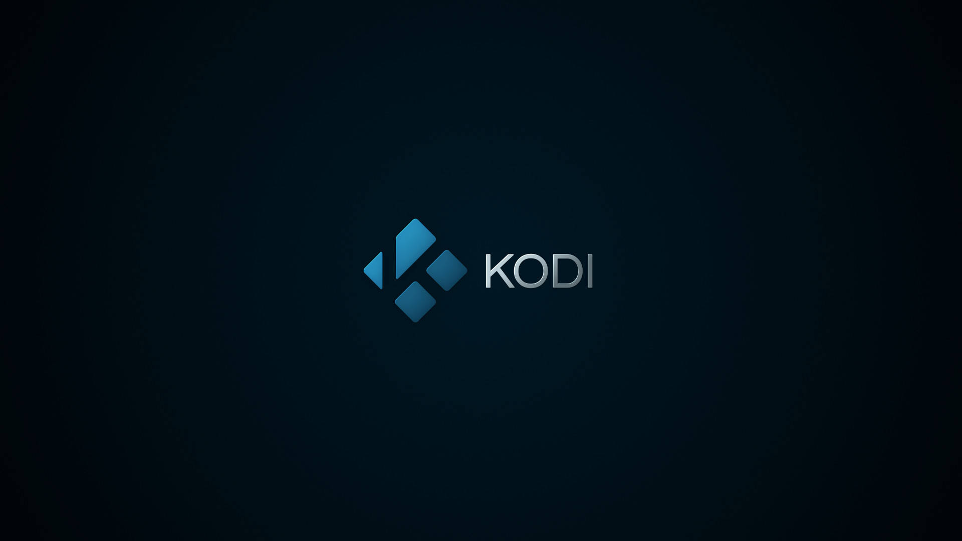 Kodi 桌布 壁紙 — Kodi 標誌居中於深藍色漸變背景上，帶有微妙的徑向光效。