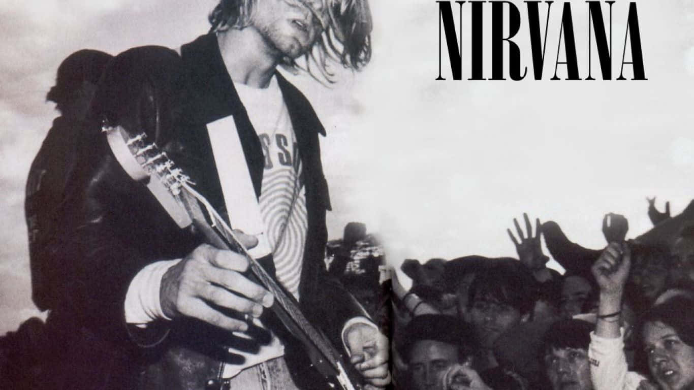 nirvana 桌布 壁紙 — Kurt Cobain 在舞台上彈吉他，人群伸手觸碰他的黑白照片。