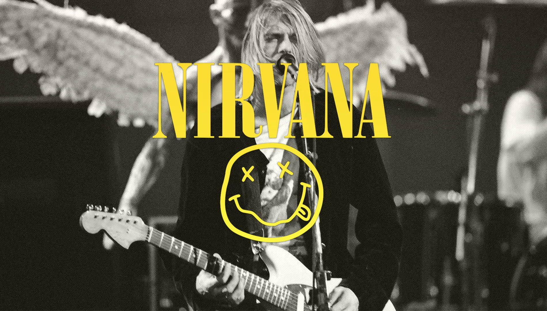nirvana 4K 桌布 壁紙 — Kurt Cobain 彈吉他的黑白照片，帶有天使翅膀和黃色Nirvana標誌覆蓋層。