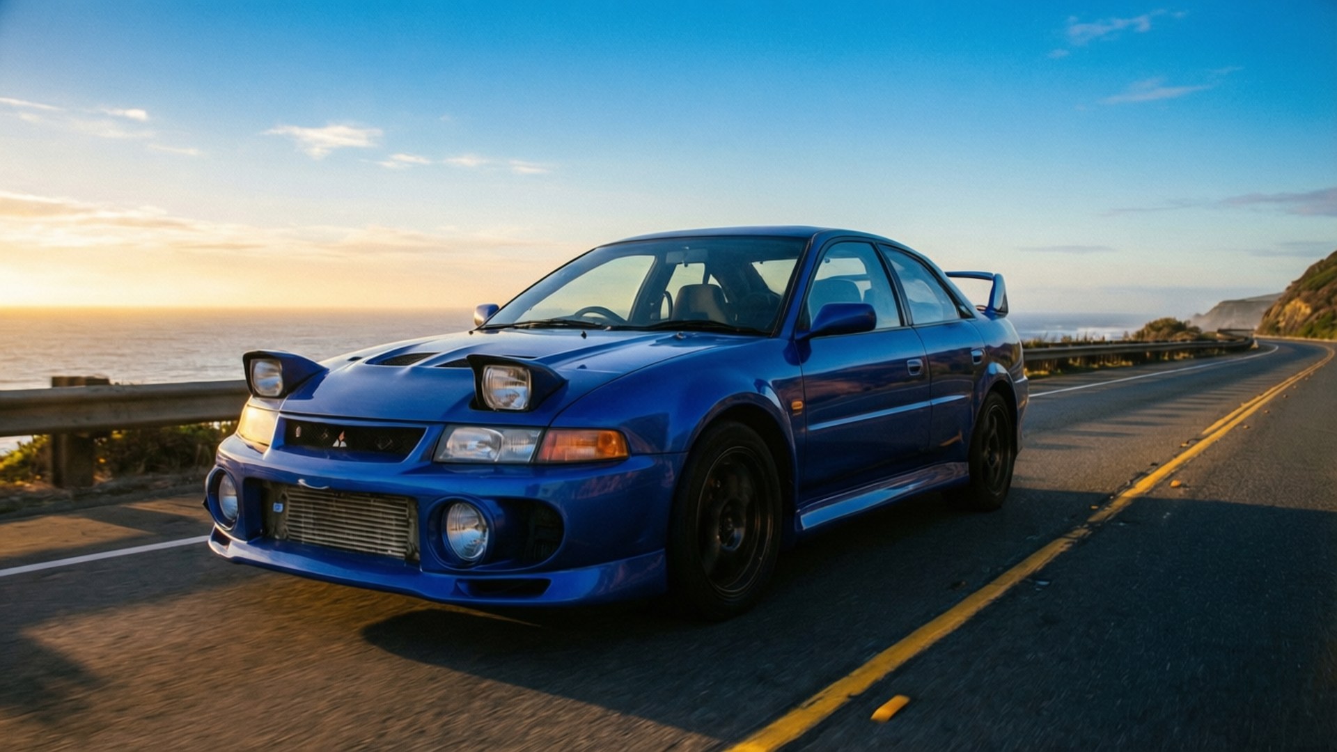 3000GT Sunrise Cruise 壁紙 — 一輛充滿活力的藍色三菱Lancer Evolution在日落時分沿著海岸公路飛馳，享有海景和金色光線。