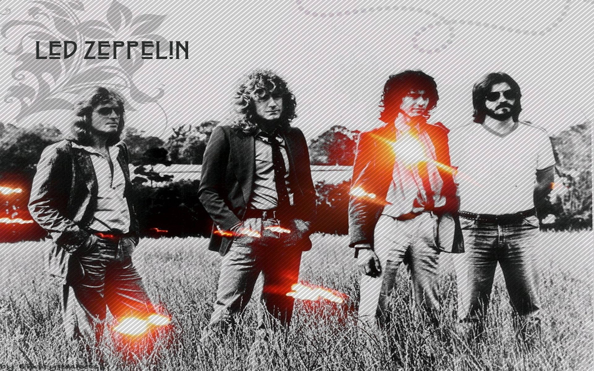 band 桌布 壁紙 — Led Zeppelin 樂團成員站在一片田野中，帶有熾熱的紅色燈光效果和復古紋理背景。