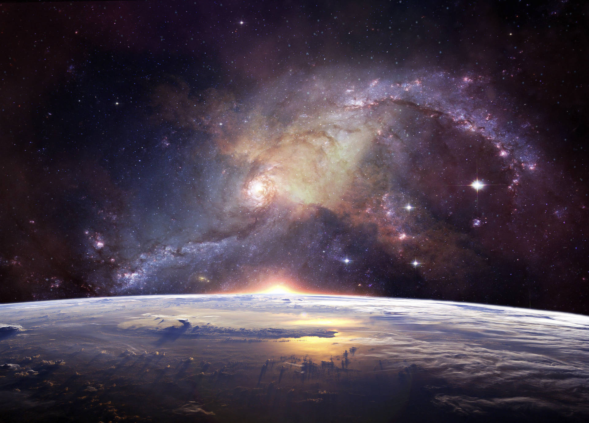 日出時的地球地平線，上方有明亮的螺旋星系 — 太空 壁紙
