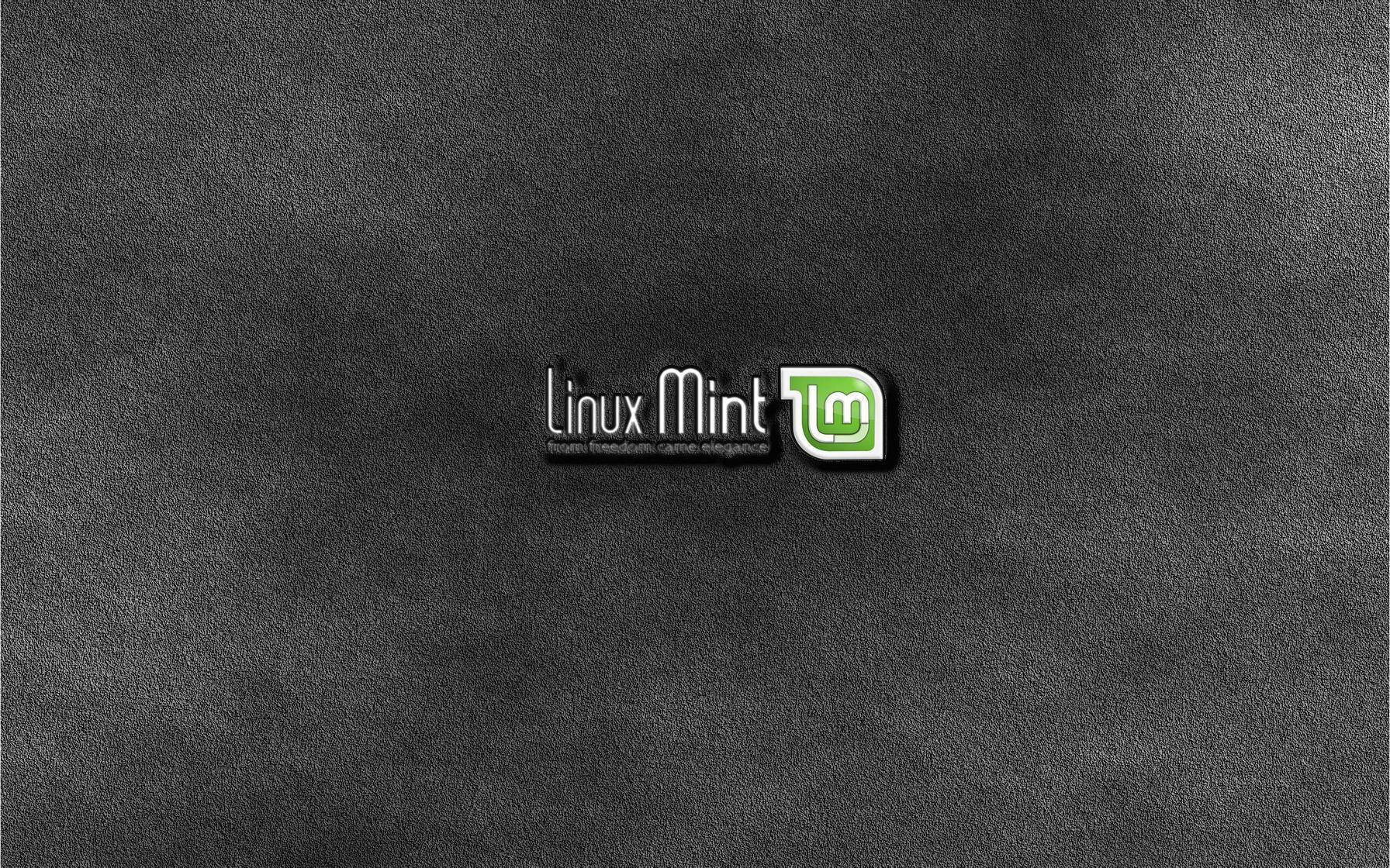 Linux 桌布 壁紙 — Linux Mint 標誌居中於深色紋理灰色背景上，帶有柔和燈光。
