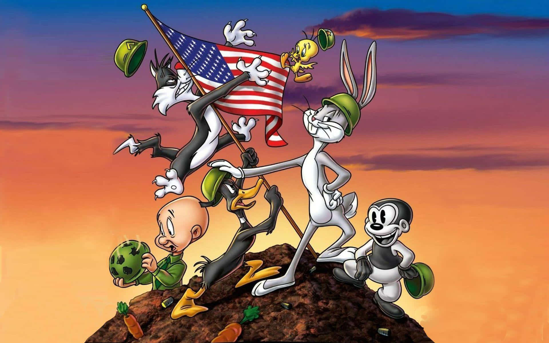 樂一通 桌布 壁紙 — Looney Tunes 角色身穿軍裝，在山頂上於日落時揮舞美國國旗慶祝。