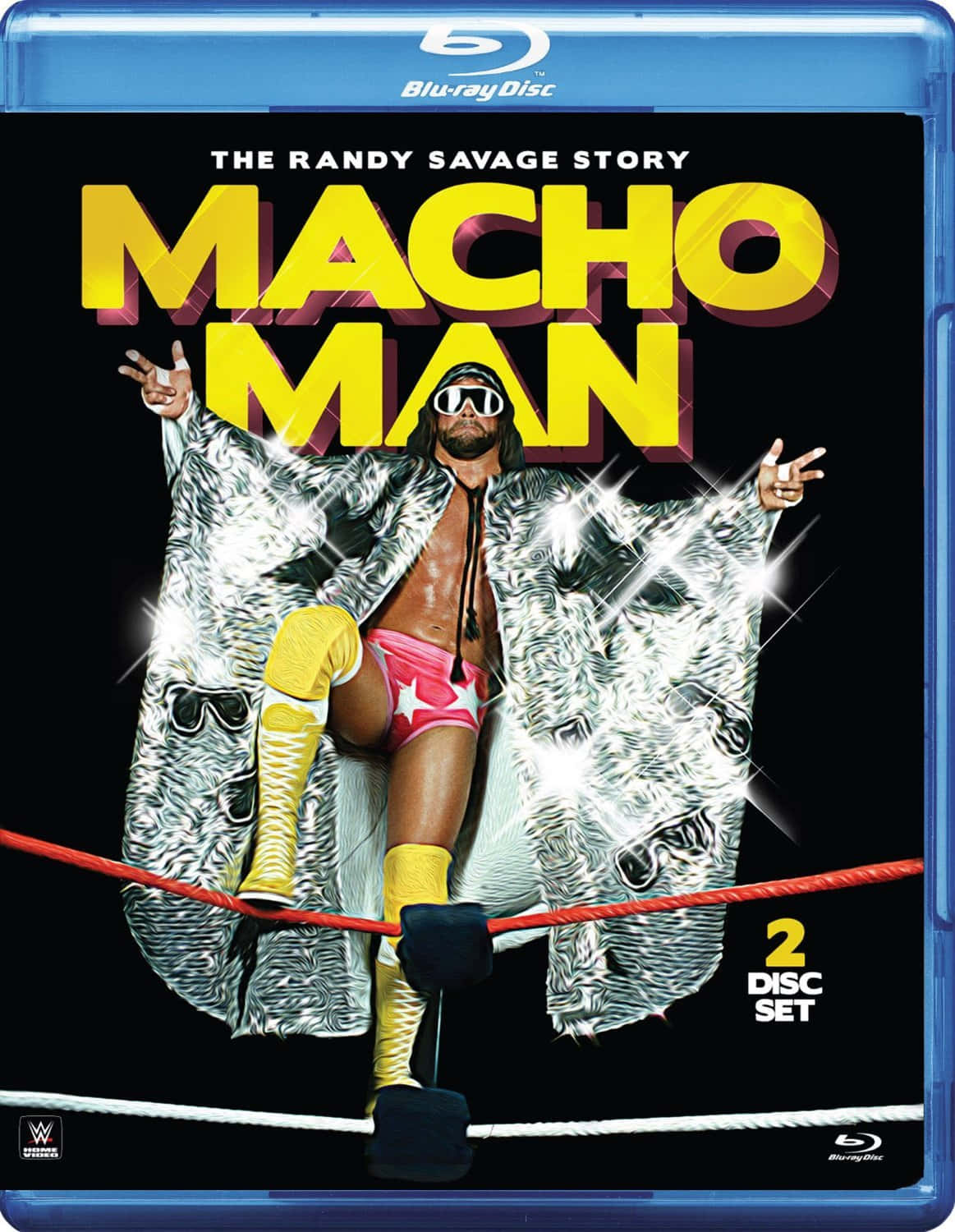 WWE 桌布 壁紙 — Macho Man Randy Savage 身穿標誌性銀色外套和粉紅色短褲，在摔角擂台角柱頂上擺出勝利姿勢。