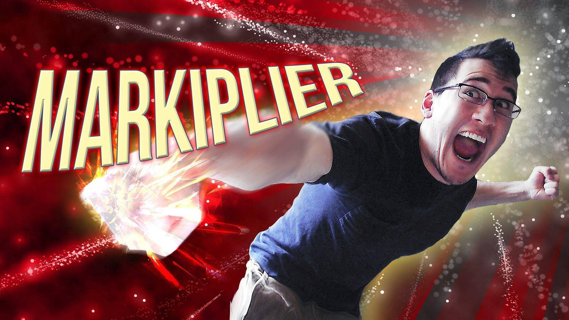 Markiplier 桌布 壁紙 — Markiplier 以動感姿勢，發光拳頭，襯托鮮豔的紅色和金色粒子背景。