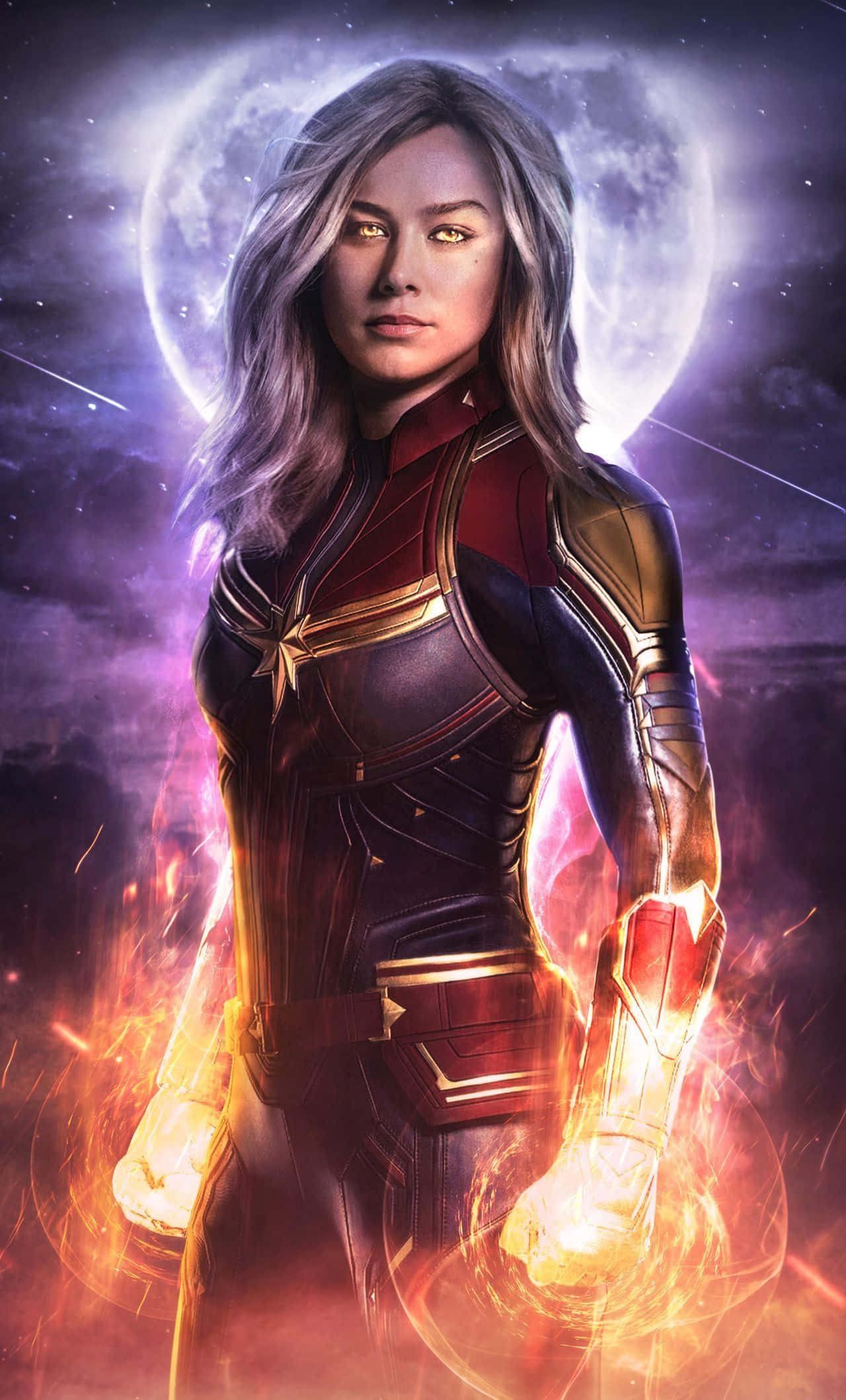 Captain Marvel 3d 桌布 壁紙 — Marvel隊長在宇宙背景下強勢站立，周圍有發光的月亮和在她拳頭周圍旋轉的火焰能量。