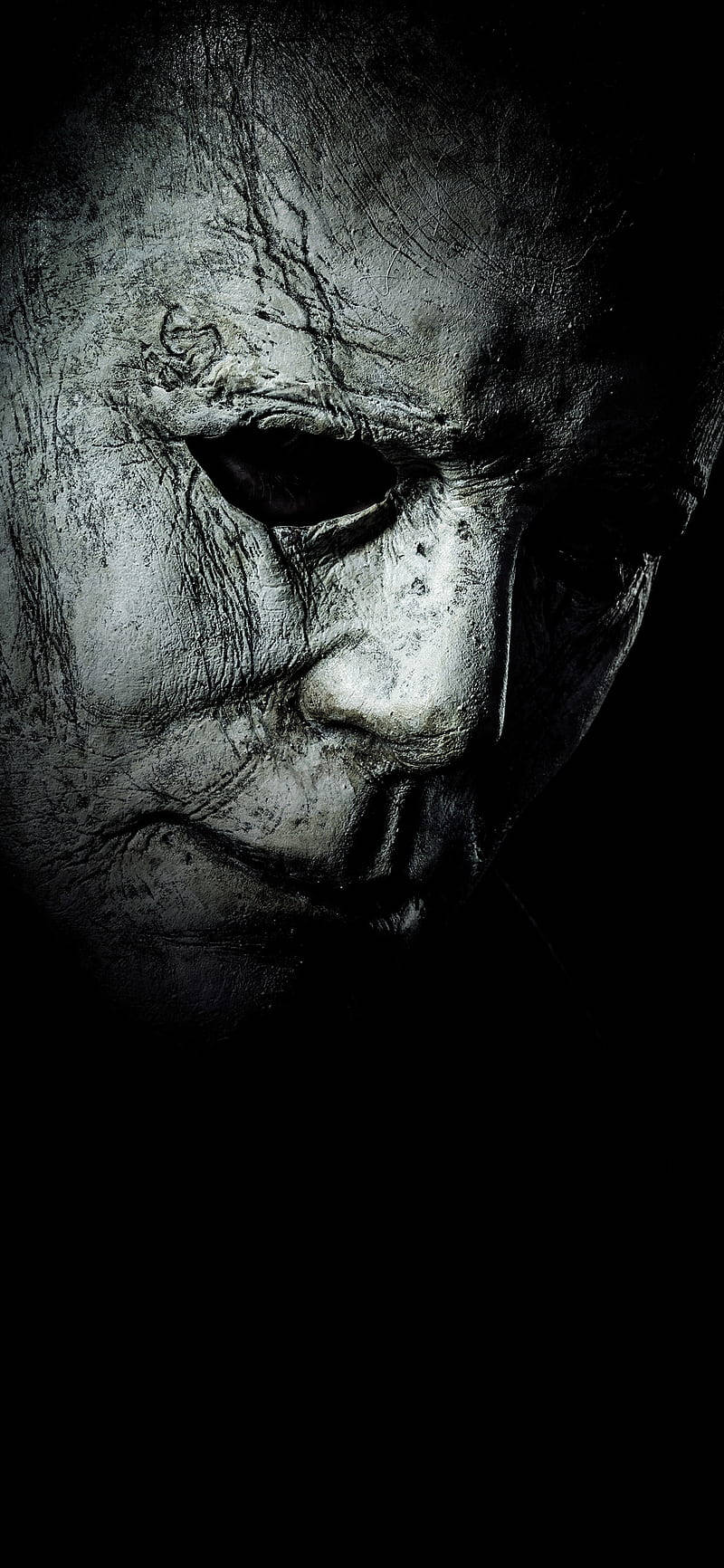 Michael Myers 戴面具的臉部在黑暗陰影中的特寫。 — 恐怖電影 壁紙