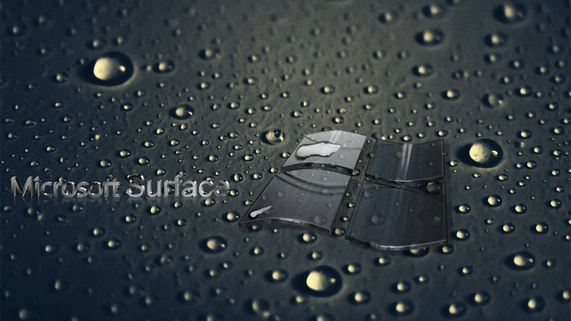 深色表面上帶有水滴的 Microsoft Surface 標誌。