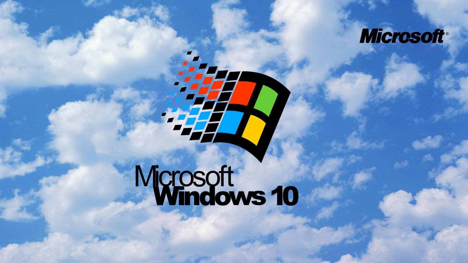 Windows 98 桌布 壁紙 — Microsoft Windows 10 標誌，採用色彩繽紛的像素化視窗設計，背景是明亮的藍天和蓬鬆的白雲。