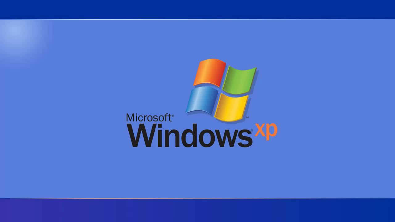  壁紙 — Microsoft Windows XP 標誌居中於帶有微妙光效的漸變藍色背景上。