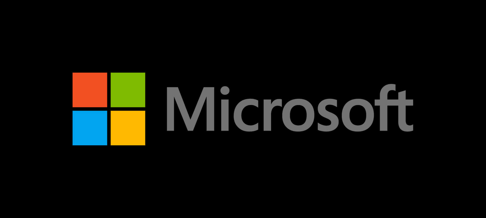 Microsoft 標誌，黑色背景上有四個彩色正方形。 — Microsoft 壁紙