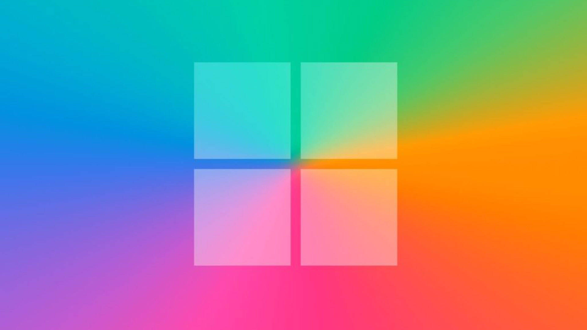Windows 11 桌布 壁紙 — Microsoft 標誌以四個正方形居中於混合藍、綠、黃和粉紅色的鮮豔漸變背景上。