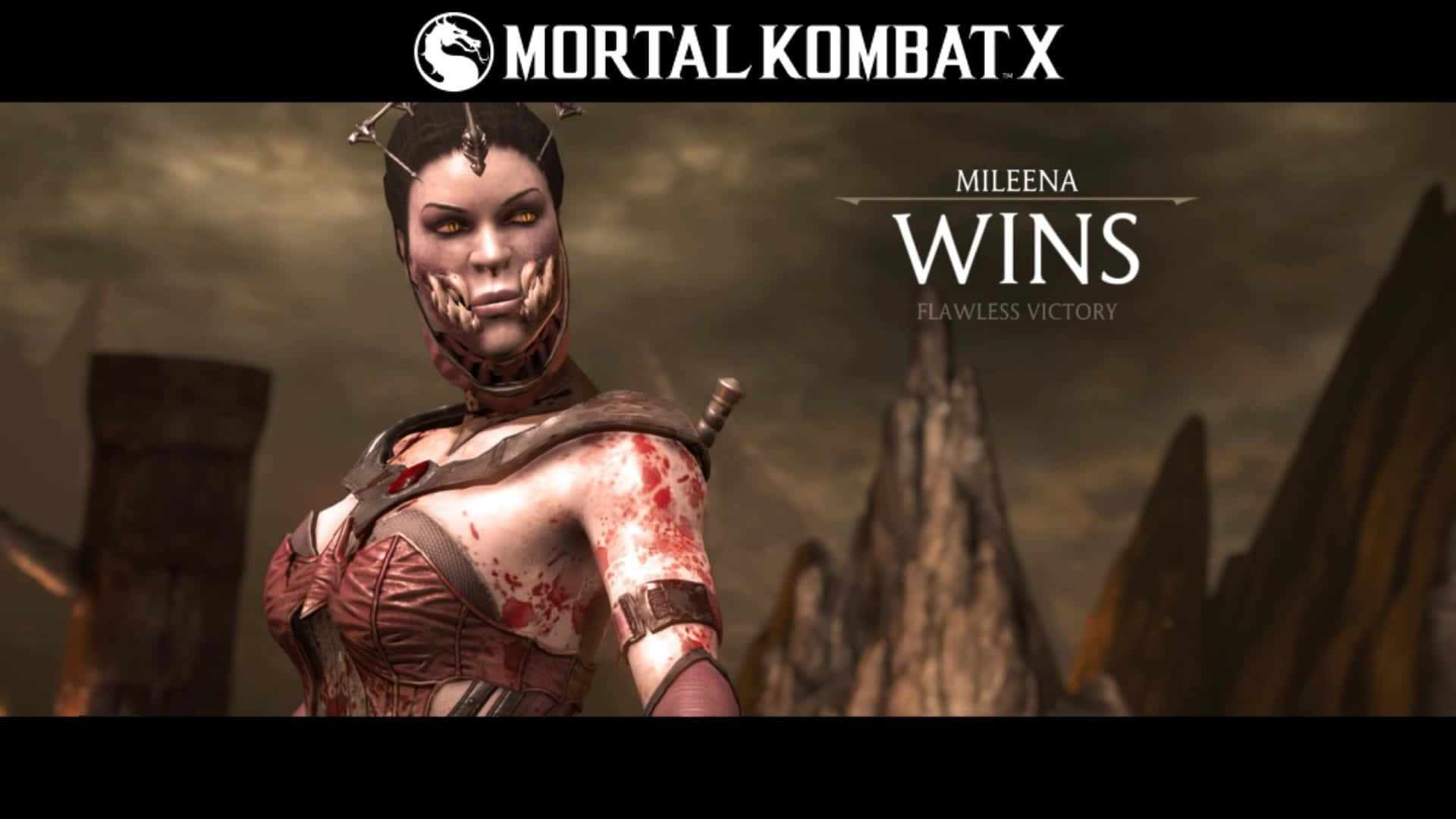 Mortal Kombat Mileena 桌布 壁紙 — Mileena 來自 Mortal Kombat X 穿著沾滿血跡的服裝，在荒涼的岩石背景下勝利站立。