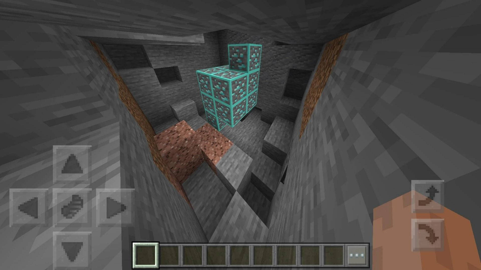 我的世界 鑽石 桌布 壁紙 — Minecraft 洞穴內的第一人稱視角，發光的青色鑽石方塊堆疊在豎井中。