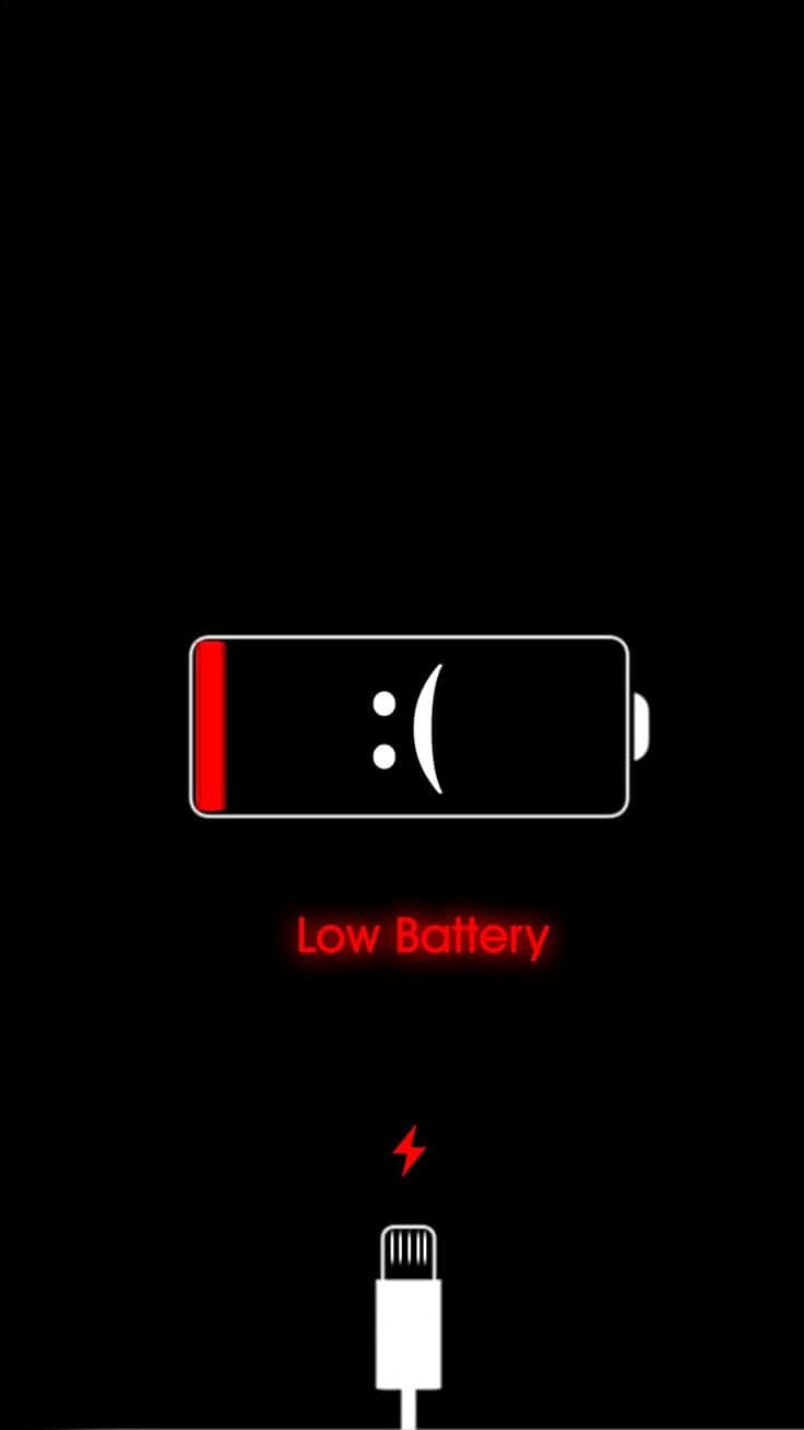 黑色背景上帶有悲傷表情和充電線的低電量警告。 — iPhone 11 壁紙