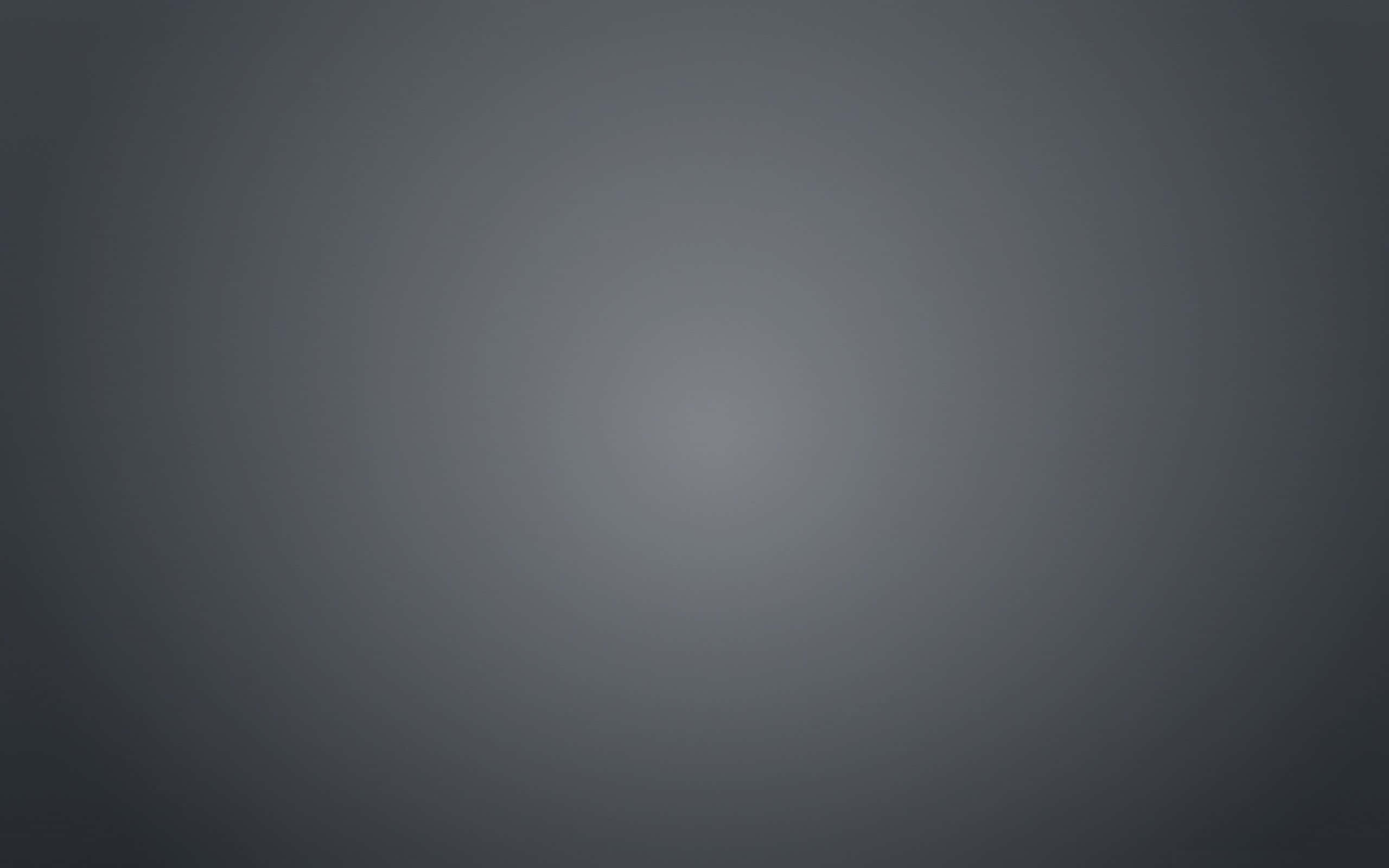 Grey Texture 桌布 壁紙 — 極簡漸變桌布，柔和灰色調從深色邊緣漸變至明亮中心。