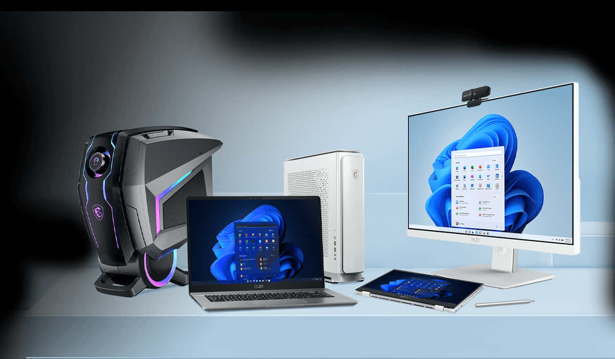 遊戲和生產力技術陣容，配備發光的RGB PC塔、筆記型電腦、平板電腦和顯示器，顯示Windows 11。 — Dell 壁紙